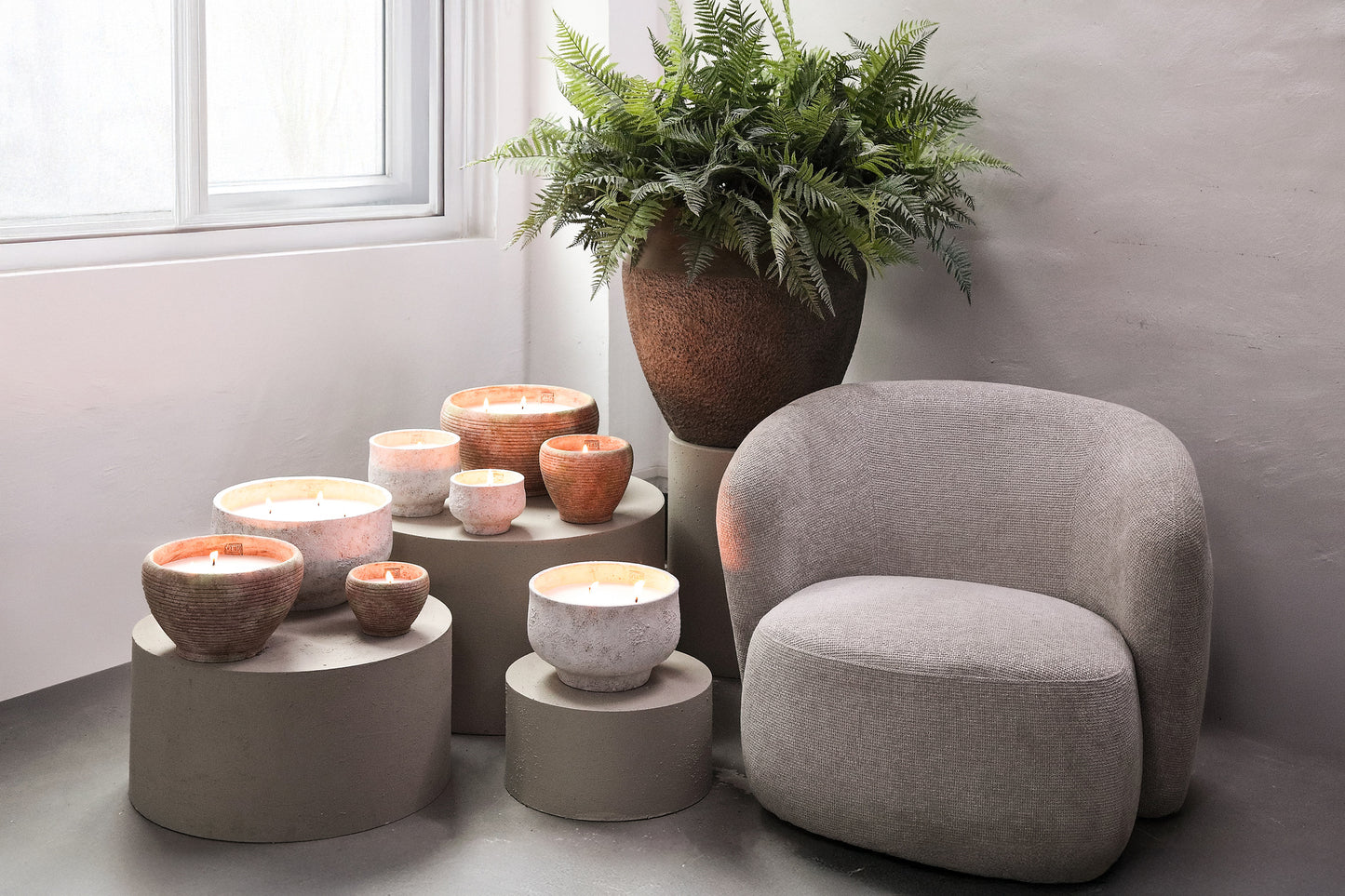 Sarai White cement outdoor candle rounded